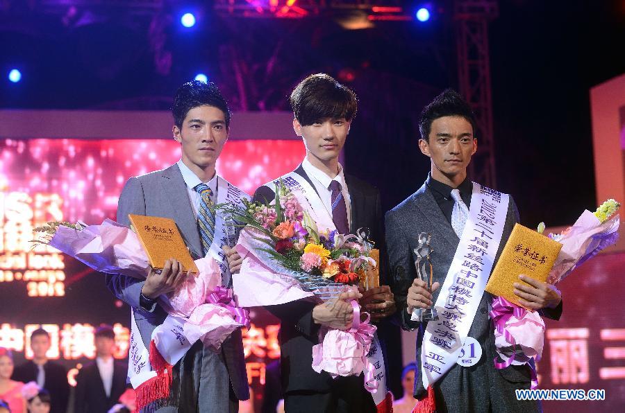 The winners of male models pose for a group photo in a model competition in Sanya, south China's Hainan Province, Nov. 30, 2012. The final of the 20th New Silk Road Model Competition was held here on Friday. (Xinhua/Jin Liangkuai)