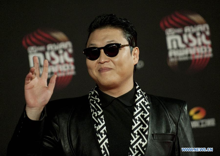 South Korean pop singer Psy waves to the crowd at 2012 Mnet Asian Music Awards (MAMA) in south China's Hong Kong, Nov. 30, 2012. MAMA is one of the most famous music gala in Asia. Psy's song "Gangnam Style" has swept the world this year. (Xinhua/Lui Sui Wai) 