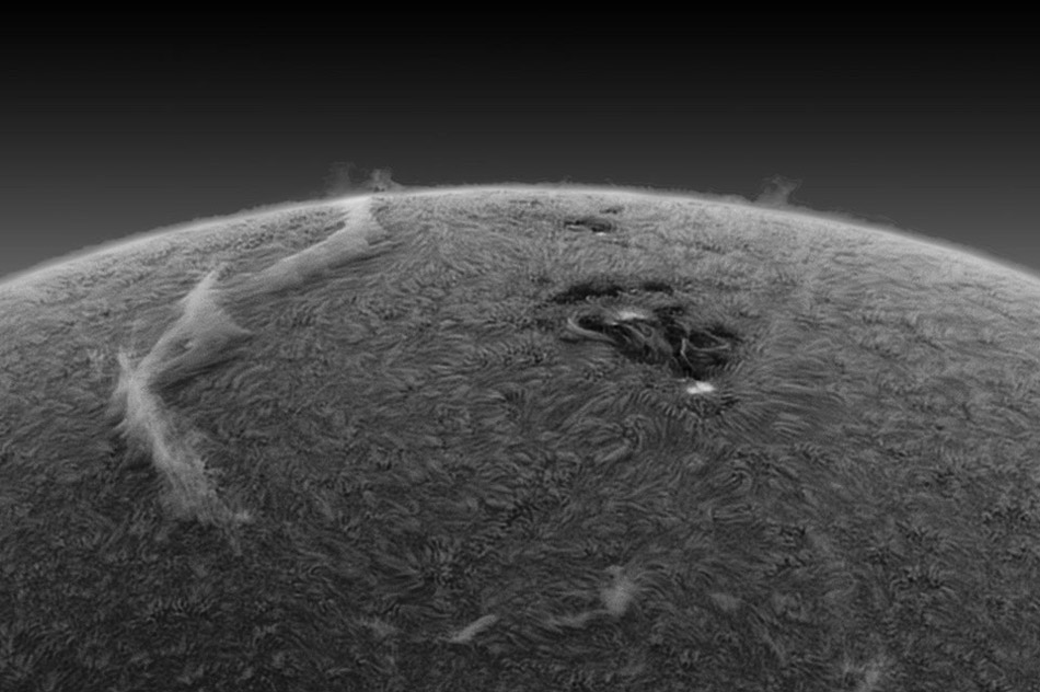 A Filament Across the Sun. Is that a cloud hovering over the Sun? Yes, but it is quite different than a cloud hovering over the Earth. The long light feature on the left of the above color-inverted image is actually a solar filament and is composed of mostly charged hydrogen gas held aloft by the Sun's looping magnetic field. (Photo/ NASA)