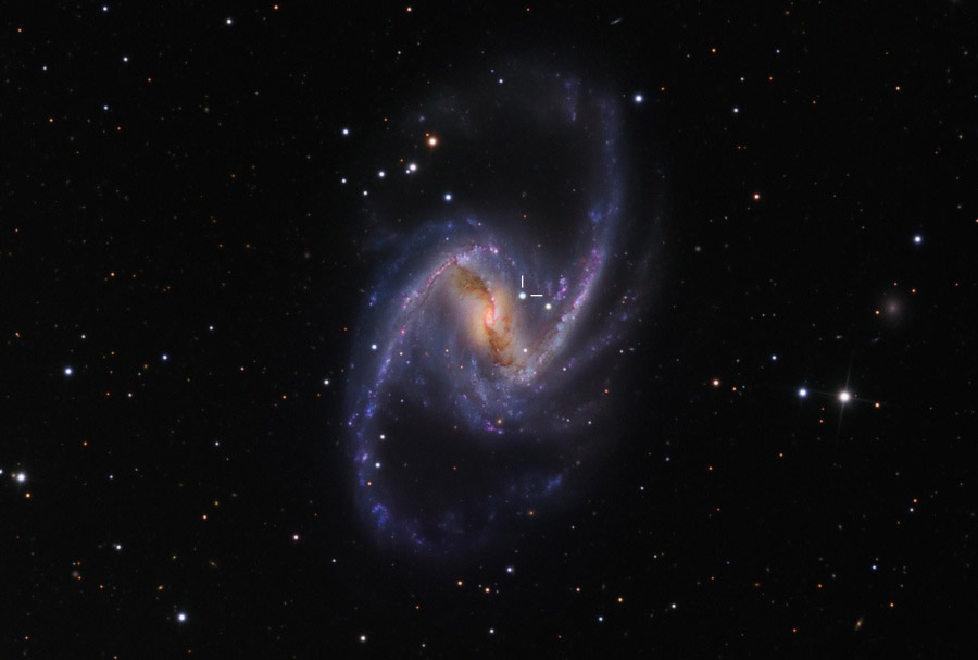 NGC 1365: Majestic Spiral with Supernova. Barred spiral galaxy NGC 1365 is truly a majestic island universe some 200,000 light-years across. Located a mere 60 million light-years away toward the chemical constellation Fornax, NGC 1365 is a dominant member of the well-studied Fornax galaxy cluster. (Photo/ NASA)