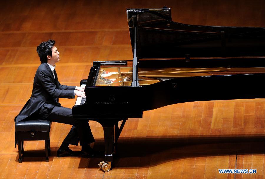 Chinese pianist Li Yundi gives performance at the National Centre for the Performing Arts (NCPA) in Beijing, capital of China, Dec. 1, 2012. (Xinhua/Luo Xiaoguang)