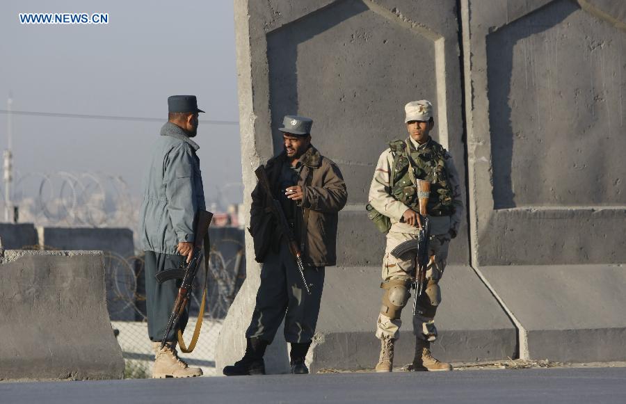 Afghan soldiers stand guard at the site of an attack in Nangarhar Province, Afghanistan, on Dec. 2, 2012. At least 11 people were killed when several Taliban militants armed with suicide vests and weapons stormed an Afghan-NATO base in Jalalabad, the capital city of Afghanistan's eastern province of Nangarhar Sunday morning. (Xinhua/Tahir Safi)