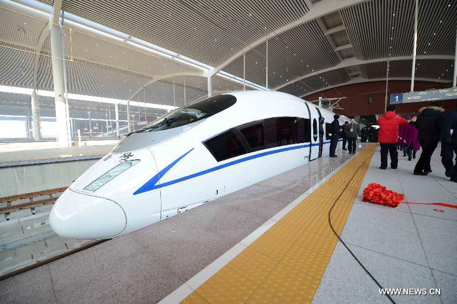 A high-speed train is seen at the Harbin West Railway Station in Harbin, capital of northeast China's Heilongjiang Province, Dec. 1, 2012. The world's first high-speed railway in areas with extremely low temperature, which runs through three provinces in northeastern China, started operation on Saturday. The railway links Harbin, capital of Heilongjiang Province, and Dalian, a port city in Liaoning Province. (Xinhua/Wang Kai)