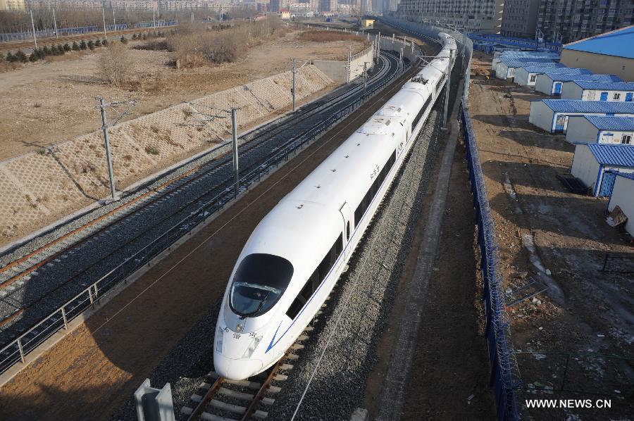 A high-speed train leaves the Shenyang North Railway Station in Shenyang, capital of Liaoning, Dec. 1, 2012. The world's first high-speed railway in areas with extremely low temperature, which runs through three provinces in northeastern China, started operation on Saturday. The railway links Harbin, capital of Heilongjiang Province, and Dalian, a port city in Liaoning Province. (Xinhua)
