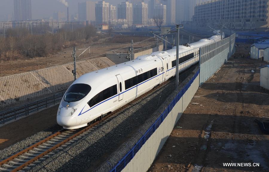 A high-speed train leaves the Shenyang North Railway Station in Shenyang, capital of Liaoning, Dec. 1, 2012. The world's first high-speed railway in areas with extremely low temperature, which runs through three provinces in northeastern China, started operation on Saturday. The railway links Harbin, capital of Heilongjiang Province, and Dalian, a port city in Liaoning Province. (Xinhua)
