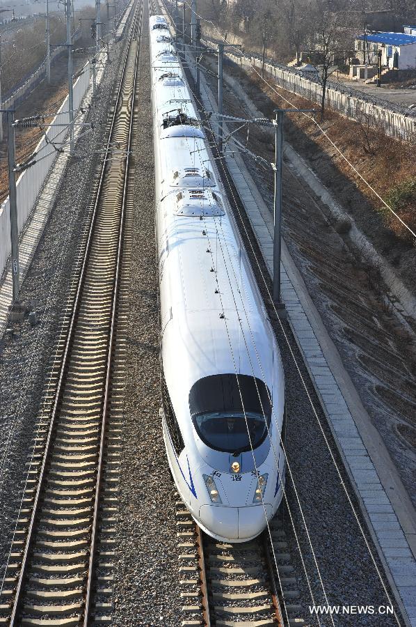 The D501 high-speed train leaves the Dalian North Railway Station in Dalian, northeast China's Liaoning Province, Dec. 1, 2012. The world's first high-speed railway in areas with extremely low temperature, which runs through three provinces in northeastern China, started operation on Saturday. The railway links Harbin, capital of Heilongjiang Province, and Dalian, a port city in Liaoning Province. (Xinhua/Liu Debin)