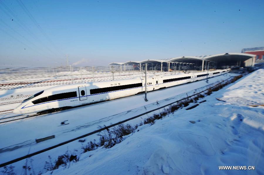 A high-speed train leaves the Harbin West Railway Station in Harbin, capital of northeast China's Heilongjiang Province, Dec. 1, 2012. The world's first high-speed railway in areas with extremely low temperature, which runs through three provinces in northeastern China, started operation on Saturday. The railway links Harbin, capital of Heilongjiang Province, and Dalian, a port city in Liaoning Province. (Xinhua/Wang Jianwei)
