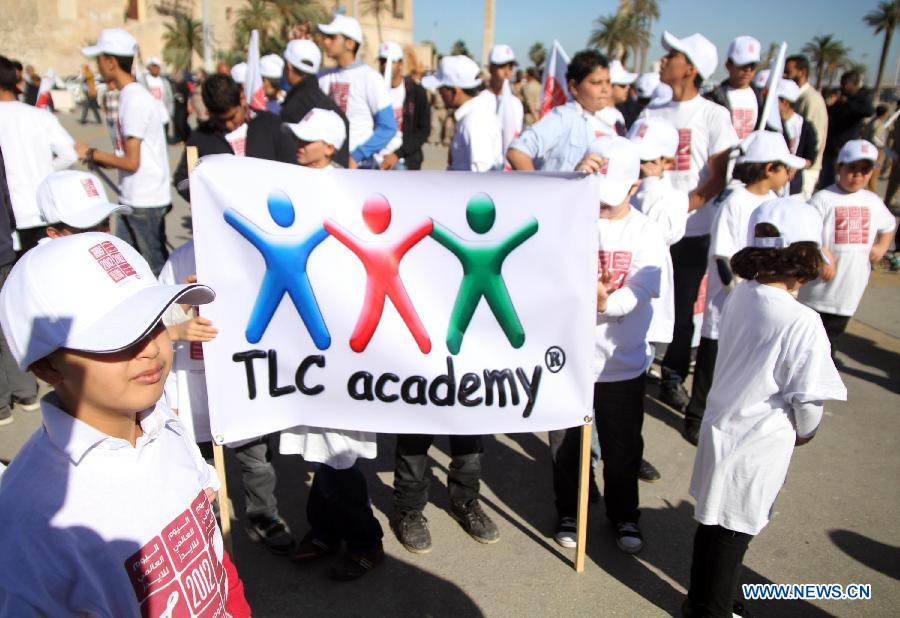 Libyan children attend the ceremony to mark the World AIDS Day in Tripoli, capital of Libya, Dec. 1, 2012. The World AIDS Day which is annually observed on Dec. 1, is dedicated to raising awareness of the AIDS pandemic caused by the spread of HIV infection. (Xinhua/Hamza Turkia) 