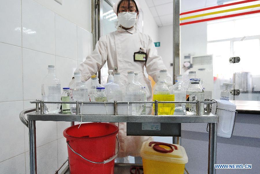 A nurse works at the Yunnan HIV/AIDS Care Center in Anning City, southwest China's Yunnan Province, Dec. 1, 2012. (Xinhua/Lin Yiguang) 