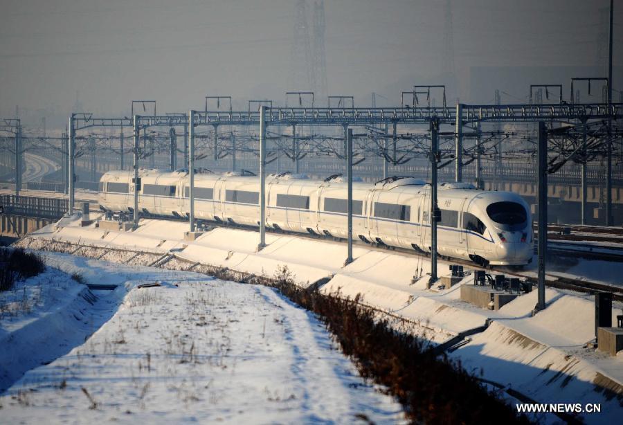 A high-speed train leaves the Harbin West Railway Station in Harbin, capital of northeast China's Heilongjiang Province, Dec. 1, 2012.  (Xinhua/Wang Jianwei)