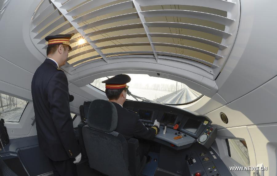 A driver works on a high-speed train leaving from Harbin, capital of northeast China's Heilongjiang Province, to Dalian, northeast China's Liaoning Province, Dec. 1, 2012.(Xinhua/Qi Heng)