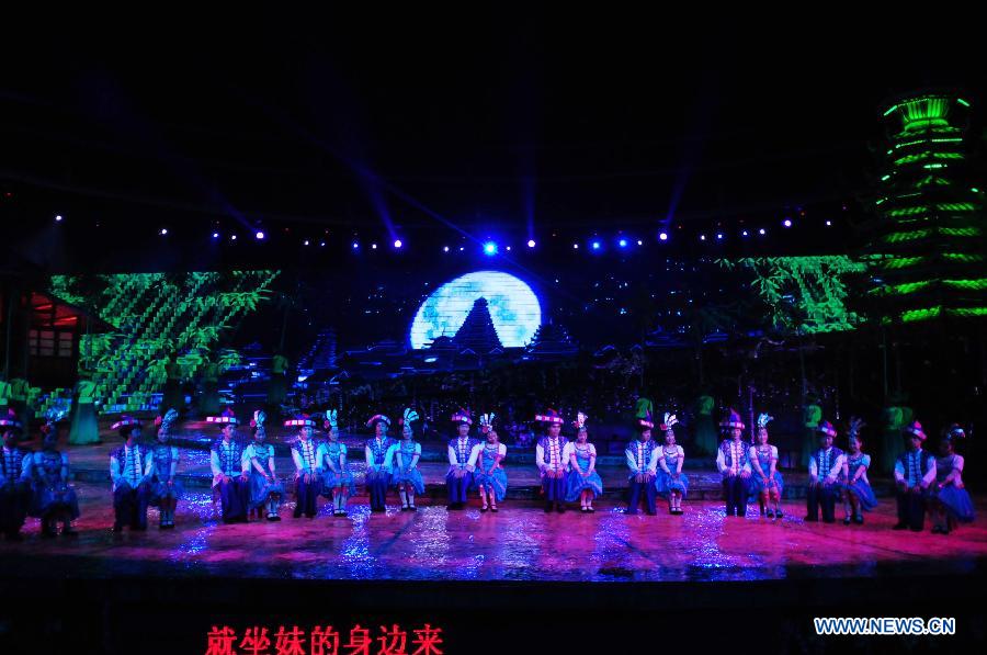 Dance drama "Zuo Ye", a traditional love and social activity of the Dong ethnic group, is performed during a festival in Sanjiang Dong Autonomous County of Liuzhou City, southwest China's Guangxi Zhuang Autonomous Region, Nov. 30, 2012. (Xinhua/Lai Liusheng) 