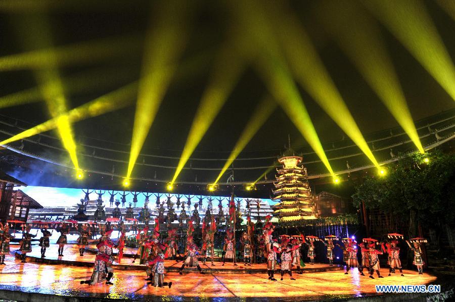 Dance drama "Zuo Ye", a traditional love and social activity of the Dong ethnic group, is performed during a festival in Sanjiang Dong Autonomous County of Liuzhou City, southwest China's Guangxi Zhuang Autonomous Region, Nov. 30, 2012. (Xinhua/Lai Liusheng) 