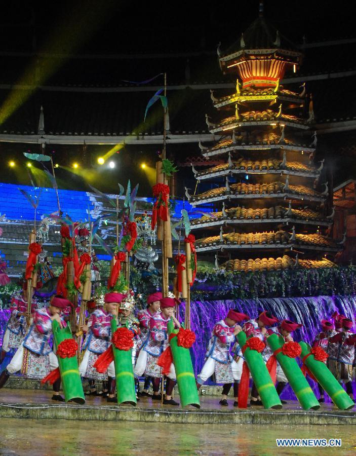Dance drama "Zuo Ye", a traditional love and social activity of the Dong ethnic group, is performed during a festival in Sanjiang Dong Autonomous County of Liuzhou City, southwest China's Guangxi Zhuang Autonomous Region, Nov. 30, 2012. (Xinhua/Lai Liusheng) 