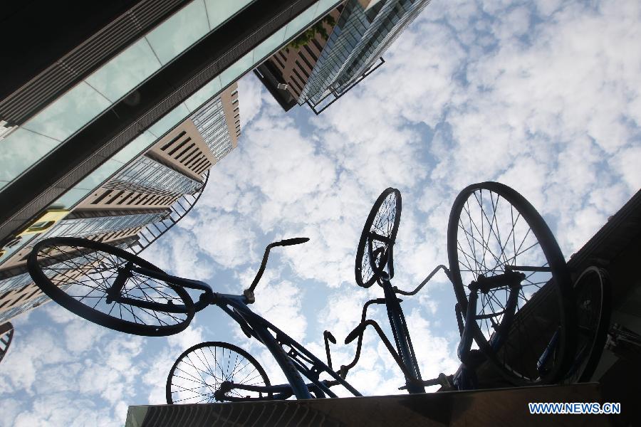 Photo taken on Nov. 20, 2012 shows bicycle sculptures presented along a street in Taipei, southeast China's Taiwan. (Xinhua/Xing Guangli)