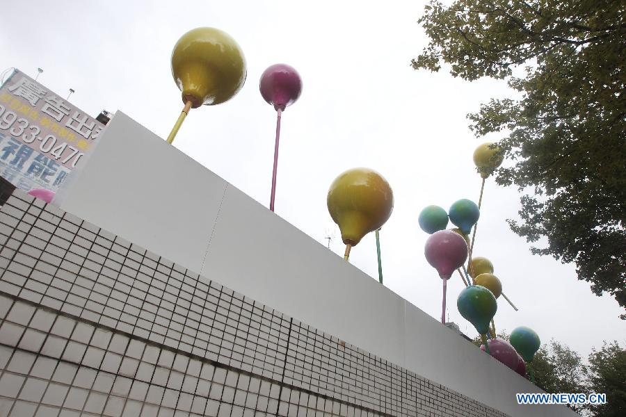 Photo taken on Dec. 3, 2012 shows art works presented along a street in Taipei, southeast China's Taiwan. (Xinhua/Xing Guangli)