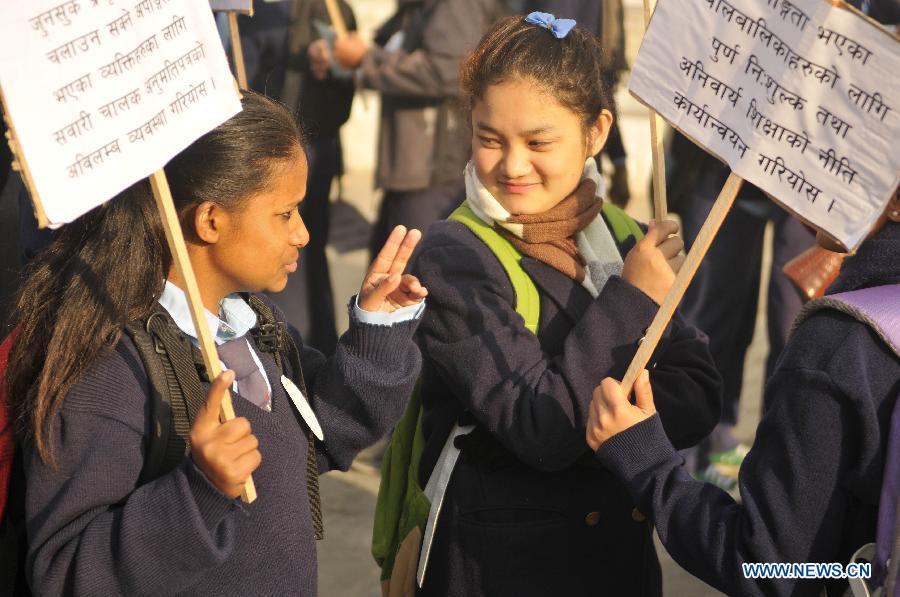 Students studying in a special school talk in sign language during a peace rally to mark the World Disabled Day in Kathmandu, Nepal, Dec. 3, 2012. (Xinhua/Sunil Pradhan)