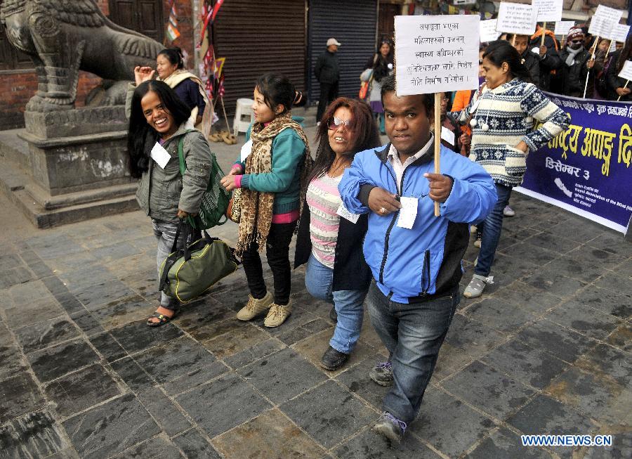 Physically disabled people participate in a peace rally to mark the World Disabled Day in Kathmandu, Nepal, Dec. 3, 2012. (Xinhua/Sunil Pradhan)