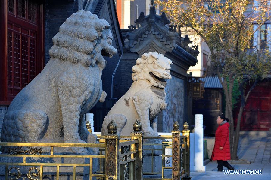 Tourists visit the Tianhou Temple in north China's Tianjin Municipality, Dec. 3, 2012. The Tianhou Temple completed its repair work and was opened to society on Monday. (Xinhua/Wang Xiaoming) 