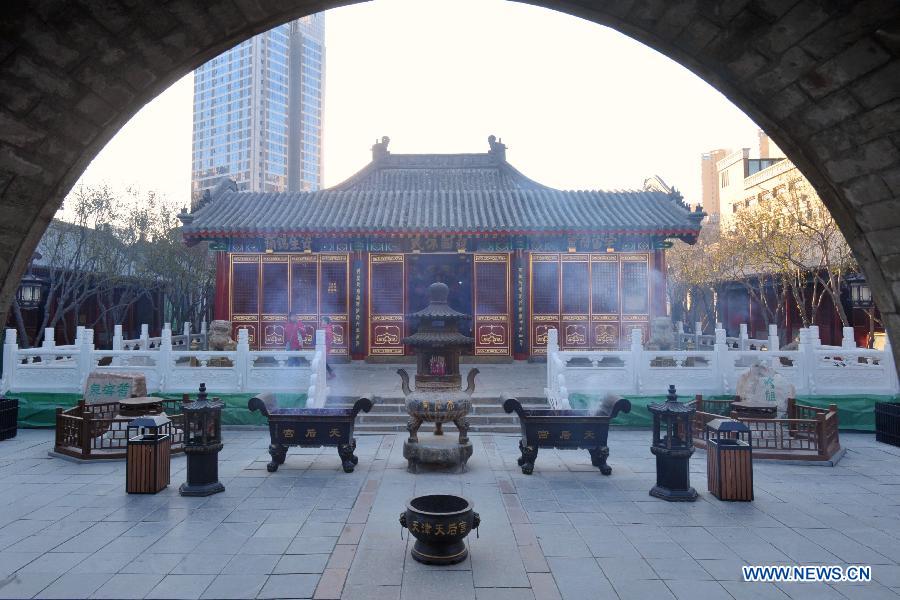 Tourists visit the Tianhou Temple in north China's Tianjin Municipality, Dec. 3, 2012. The Tianhou Temple completed its repair work and was opened to society on Monday. (Xinhua/Wang Xiaoming) 