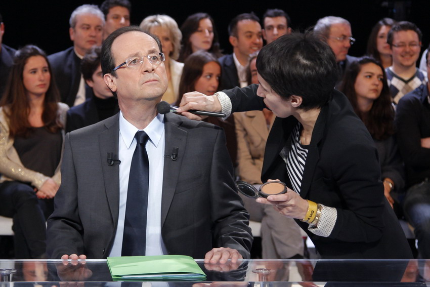 Hollande, the France Social Party candidate of 2012 presidential election, receives a make-up before attending to France TV 2 program “Language and Action”. (Reuters/ Benoit)