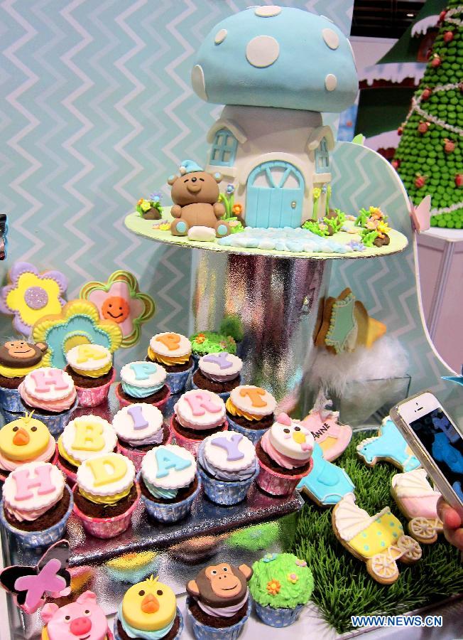 Colorful cupcakes are exhibited at the Hong Kong International Bakery Expo in Hong Kong, south China, Dec. 5, 2012. The three-day bakery event kicked off here Wednesday, involving participants from home and abroad. (Xinhua/Zhao Yusi)