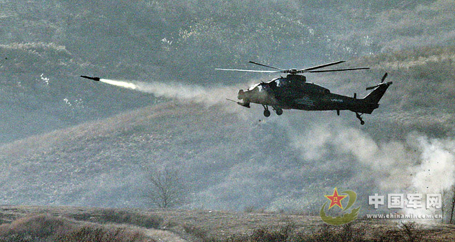 A Z-10 armed helicopter is launching air-to-ground missile. (PLA Daily/Qiao Tianfu, Zhang Junrong, Liu Feng'an and Shao Zhonghong)