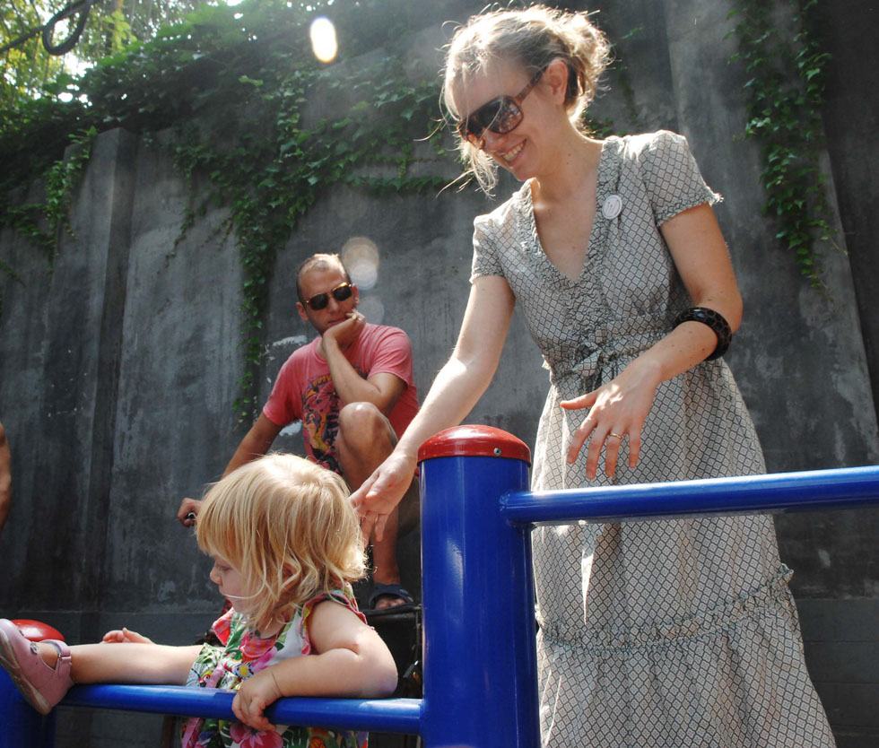 The file photo taken on July 19, 2008 shows Johnson-Hill and his wife playing with their daughter in an alley of Beijing, capital of China.