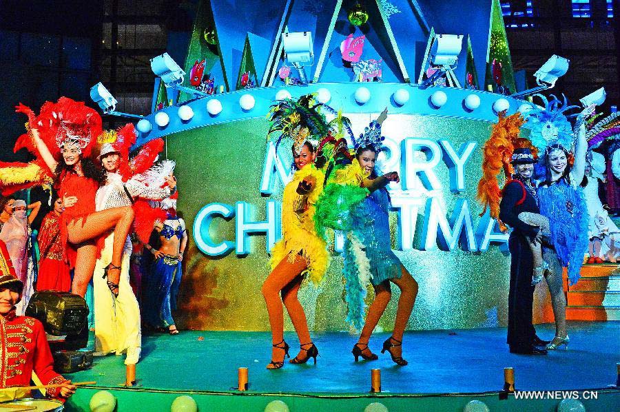 Foreign performers dance during a lighting ceremony celebrating the upcoming Christmas and new year at Shanghai Xintiandi, one of the city's tourist landmarks, in Shanghai, east China, Dec. 5, 2012. (Xinhua/Guo Changyao) 