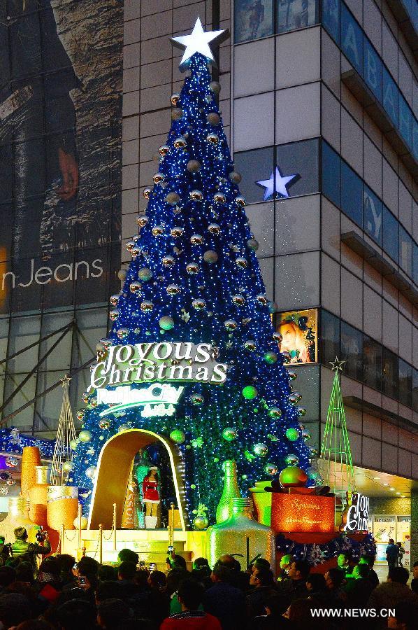 A Christmas tree illuminates during a lighting ceremony celebrating the upcoming Christmas and new year in Shanghai, east China, Dec. 5, 2012. (Xinhua/Guo Changyao) 