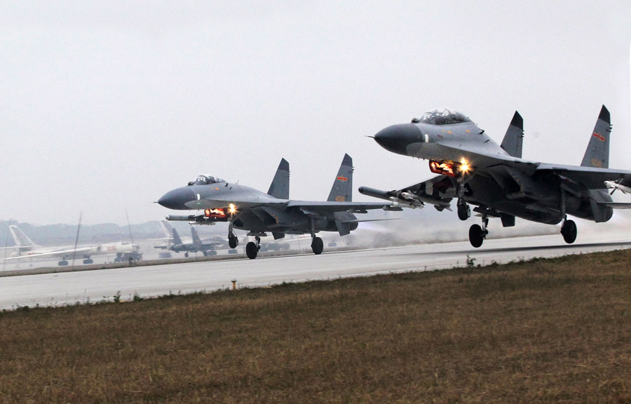 The fighters are rapidly taking off at the double-runway airport on November 29, 2012. (Xinhua/Bao Zicheng)
