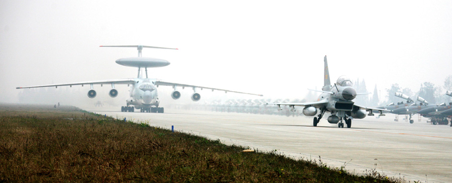 Multi types of fighters are taxiing towards the double-runway in turn on November 29, 2012. (Xinhua/Zhu Xiaolei)
