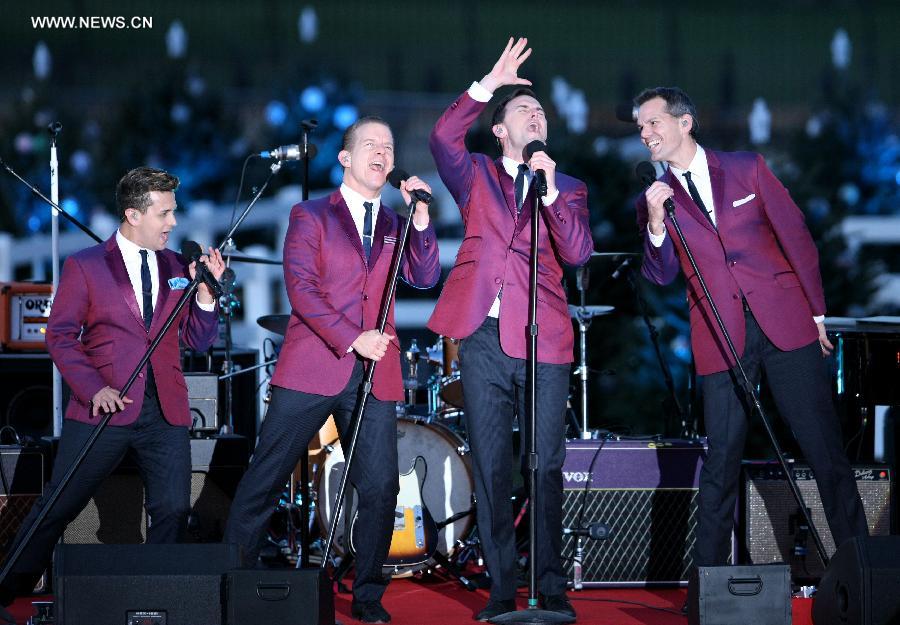 Artists perform during the ceremony of lighting the National Christmas Tree in Washington D.C, the United States, on Dec. 6, 2012. (Xinhua/Fang Zhe)