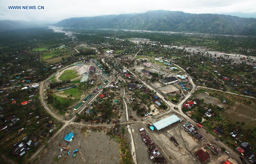 Photo taken on Dec. 7, 2012 shows the typhoon-affected area in southern province of Compostela Valley, the Philippines. The death toll of Typhoon Bopha, locally known as Pablo, has climbed to 456 as more bodies were dug out from disaster-affected areas in southern Philippines, the National Disaster Risk Reduction and Management Council (NDRRMC) announced on Friday. (Xinhua/Jay Morales) 