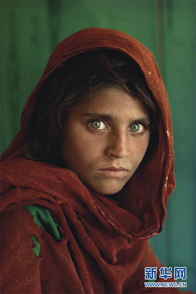“Afghan Girl” by Steve McCurry is sold for 178,900 U.S. dollars as the highest bid at the Christie’s on New York on Dec. 6, 2012. (Xinhua/Steve McCurry/National Geographic/Christie's Images)