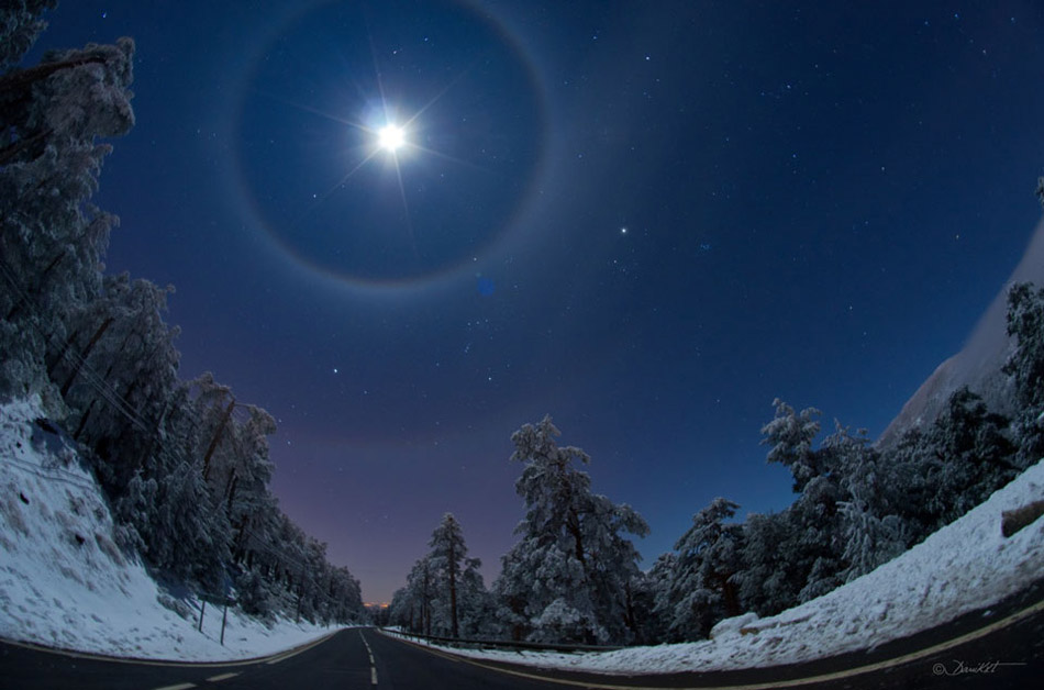 A Quadruple Lunar Halo Over Spain. Sometimes falling ice crystals make the atmosphere into a giant lens causing arcs and halos to appear around the Sun or Moon. This past Saturday night was just such a time near Madrid, Spain, where a winter sky displayed not only a bright Moon but as many as four rare lunar halos. (Photo/ NASA)