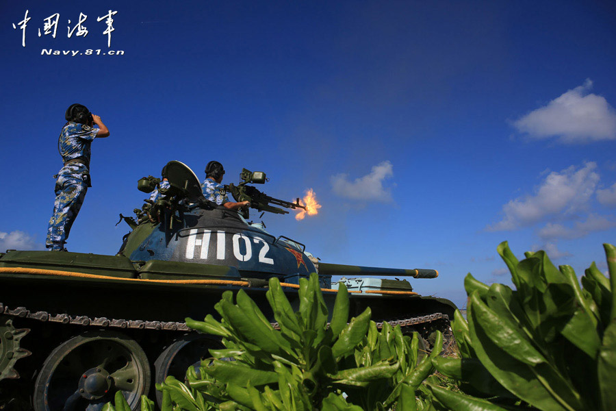 A tank company under a maritime garrison command of the Chinese People's Liberation Army (PLA) stationed on the Sansha Island conducts a live-ammunition shooting training with tank-mounted anti-aircraft machine gun, in a bid to temper troops' combat capability. (navy.81.cn/Chen Xianling, Liu Weiping)
