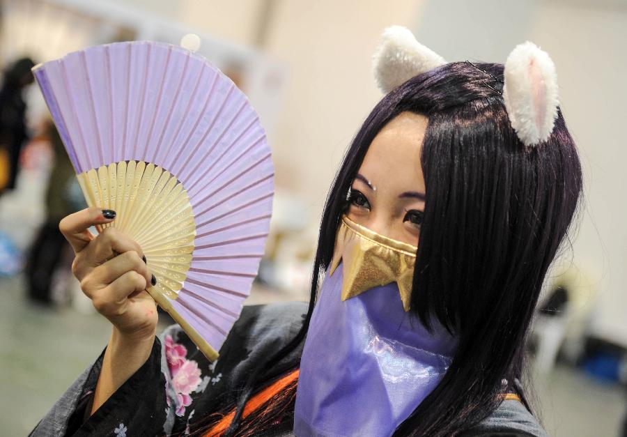 A cosplayer poses for photo during the 1st Cosplay Cultural Festival in Hangzhou, capital of east China's Zhejiang Province, Dec. 9, 2012. The two-day festival closed on Sunday. (Xinhua/Han Chuanhao)