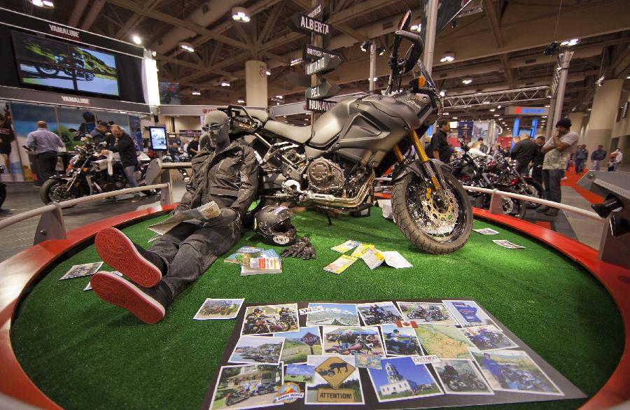 A motorcycle is on display during the 2012 Toronto Motorcycle Show at the Metro Toronto Convention Centre in Toronto, Canada, Dec. 8, 2012. The three-day event displays hundreds of new 2013 motorcycles, scooters from the world's top manufacturers from Dec. 7 to 9 this year. (Xinhua/Zou Zheng) 