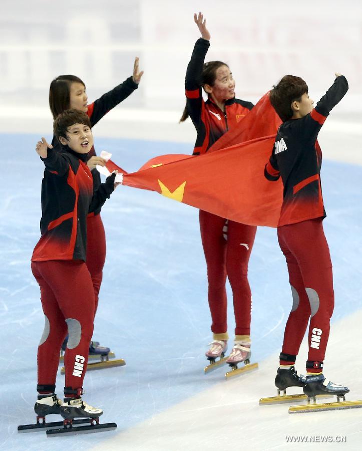 The players of China celebrate victory after winning the women's 3000m relay final during the ISU Short Track World Cup speed skating competition in Shanghai, China, on Dec. 9, 2012. China claimed the title with a time of 4 minutes 7.660 seconds. (Xinhua/Fan Jun) 