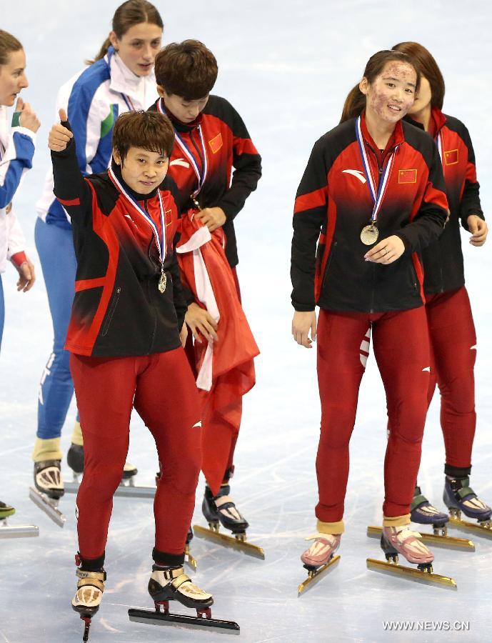 The players of China celebrate victory after winning the women's 3000m relay final during the ISU Short Track World Cup speed skating competition in Shanghai, China, on Dec. 9, 2012. China claimed the title with a time of 4 minutes 7.660 seconds. (Xinhua/Fan Jun) 