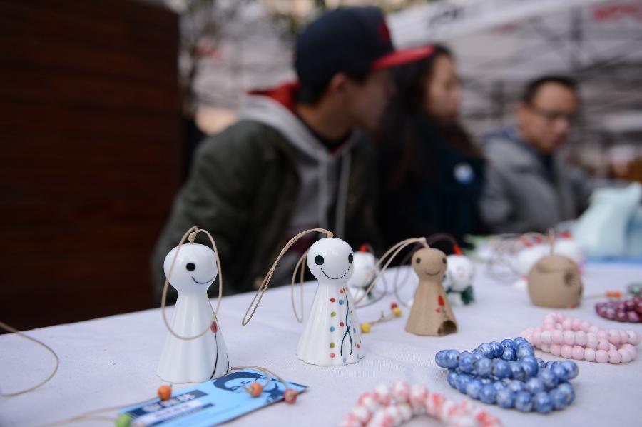 Ceramic artworks are presented in an idea fair at 791 Art Zone in Nanchang, capital of east China's Jiangxi Province, Dec. 9, 2012. (Xinhua/Zhou Mi)