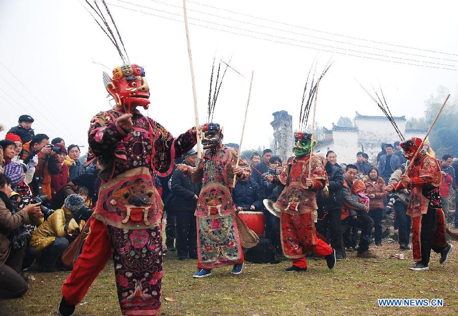 File photo taken on Jan. 24, 2012 shows Nuo dance artists giving performance in Changjing Village of Wuyuan County, east China's Jiangxi Province. (Xinhua/Zhang Weiguo)