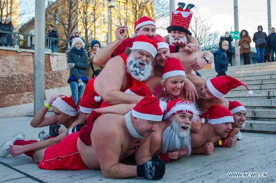 People take part in a half naked "Santa run" in Budapest, Hungary, Dec. 9, 2012. (Xinhua/Attila Volgyi) 