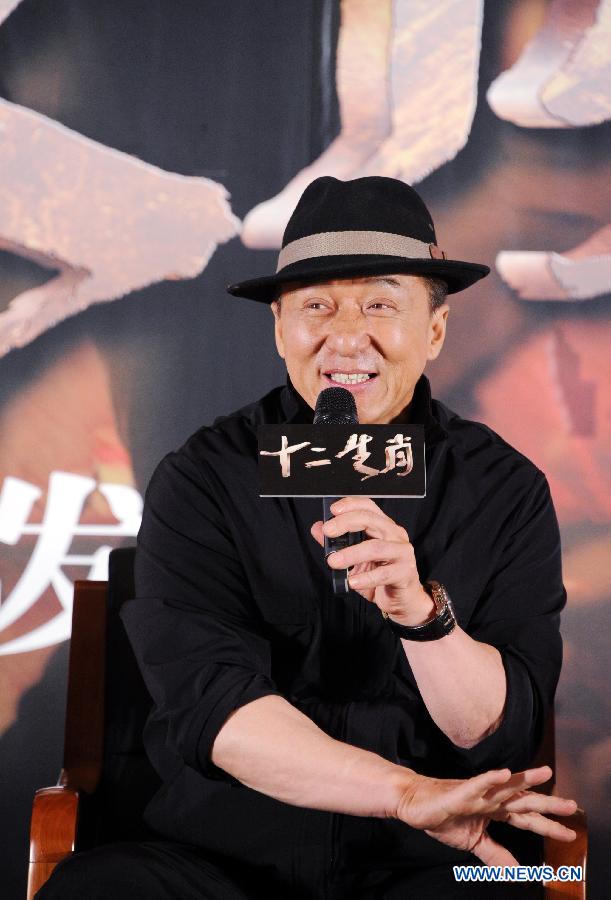 Jacky Chan is interviewed at the press premiere of his action film "CZ2012" in Beijing, capital of China, Dec. 11, 2012. "CZ2012", a work of Hong Kong-based actor and director Jacky Chan, will be released in China on Dec. 20. (Xinhua) 