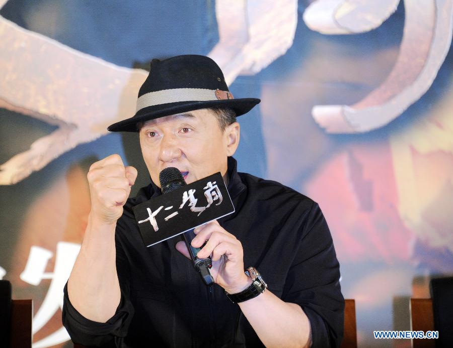 Jacky Chan is interviewed at the press premiere of his action film "CZ2012" in Beijing, capital of China, Dec. 11, 2012. "CZ2012", a work of Hong Kong-based actor and director Jacky Chan, will be released in China on Dec. 20. (Xinhua) 