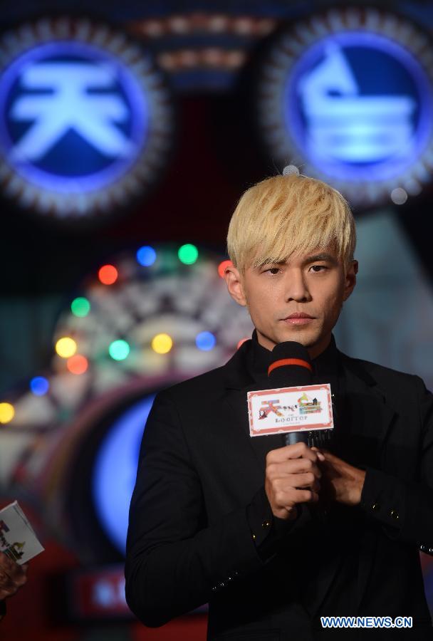 Singer-converted actor and director Jay Chou attends a press conference to promote his second self-directed movie "Rooftop" (Tian Tai) in Beijing, capital of China, on Dec. 11, 2012. (Xinhua/Yu Dian)