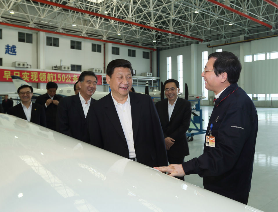 Photo released on Dec. 11, 2012 shows Xi Jinping (3rd R), general secretary of the Communist Party of China (CPC) Central Committee and chairman of the CPC Central Military Commission (CMC), visits an assembly workshop at the Zhuhai base of China Aviation Industry General Aircraft Co., Ltd. (CAIGA) in Zhuhai.(Xinhua/Lan Hongguang)
