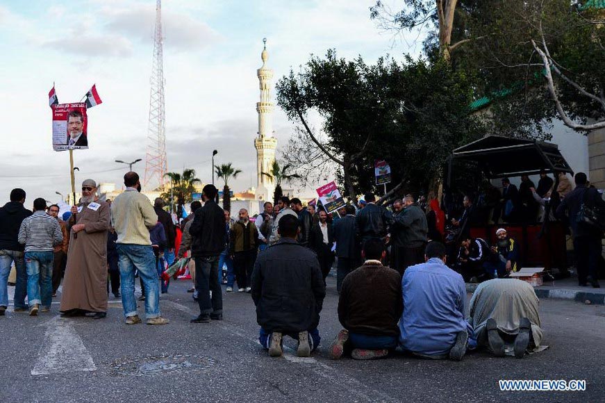 Supporters of Egyptian President Mohamed Morsi participate in a rally in Nasser city district in Cairo, Egypt, Dec. 11, 2012, four days ahead of a nationwide referendum on the new draft constitution. (Xinhua/Qin Haishi)