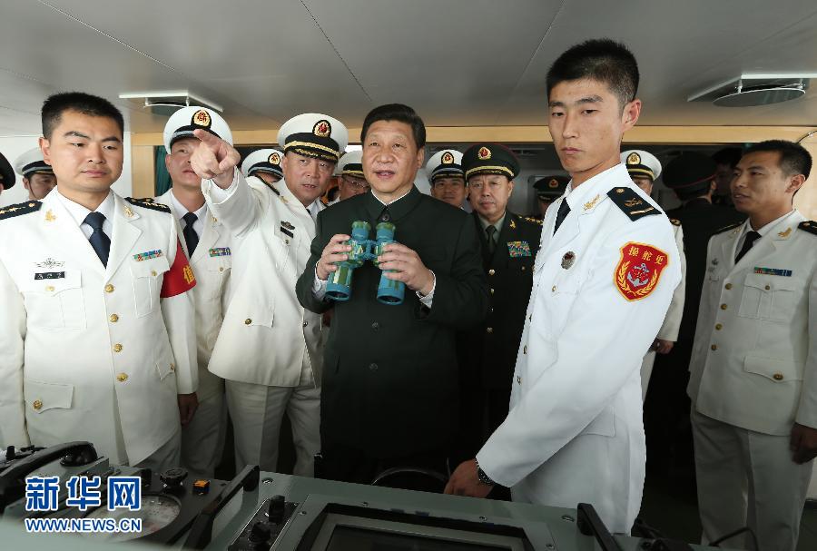 General Secretary of the Communist Party of China (CPC) Central Committee Xi Jinping (C), who is also the chairman of the CPC Central Military Commission, examines onboard the Navy destroyer Haikou during his inspection at the Guangzhou military theater of operations of the People's Liberation Army(PLA), Dec. 8, 2012. (Xinhua/Wang Jianmin)